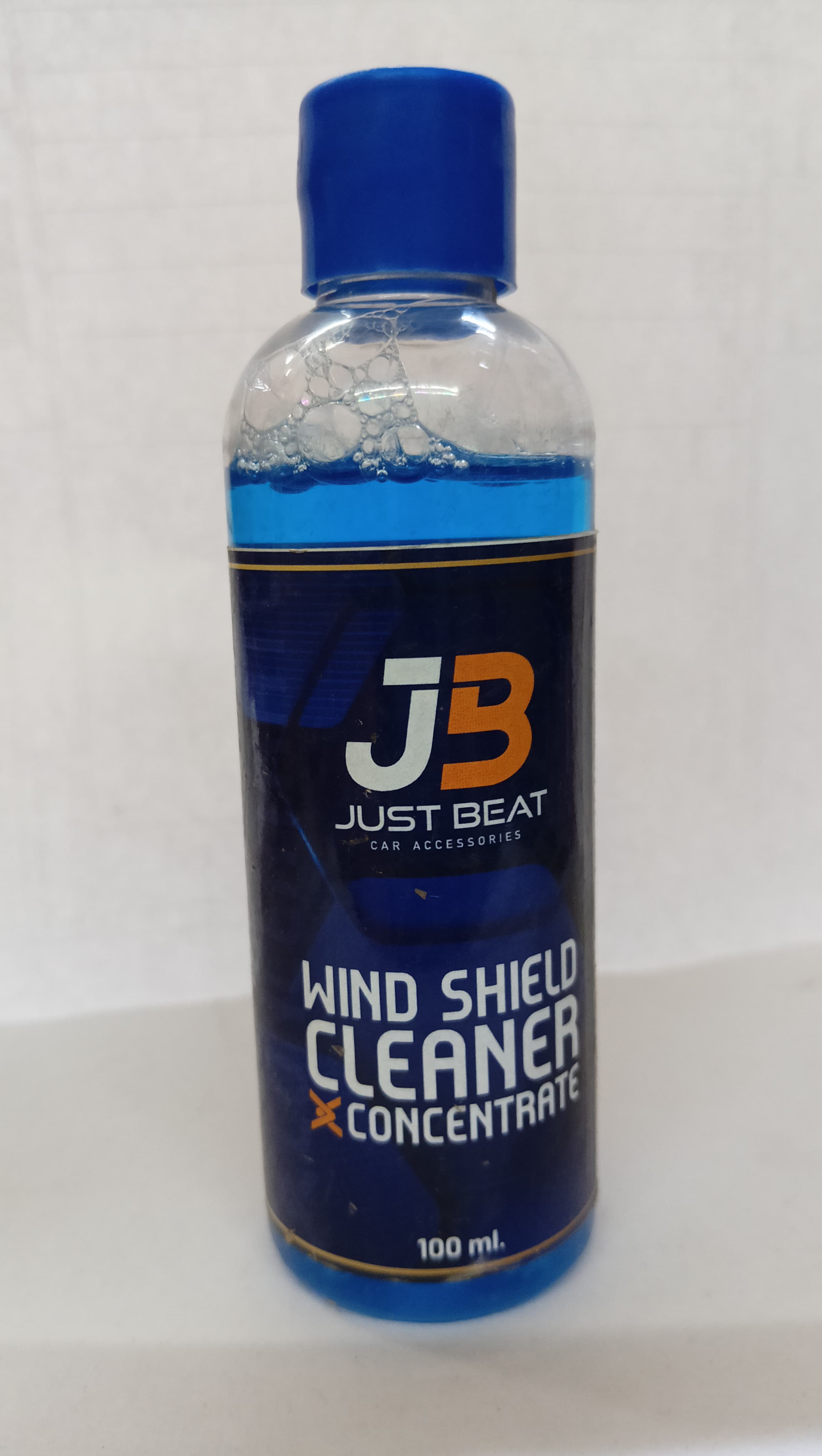 JB Wind Shield Cleaner 100ml spare part for windshield cleaning, shown in the image with bottle and spray nozzle.
