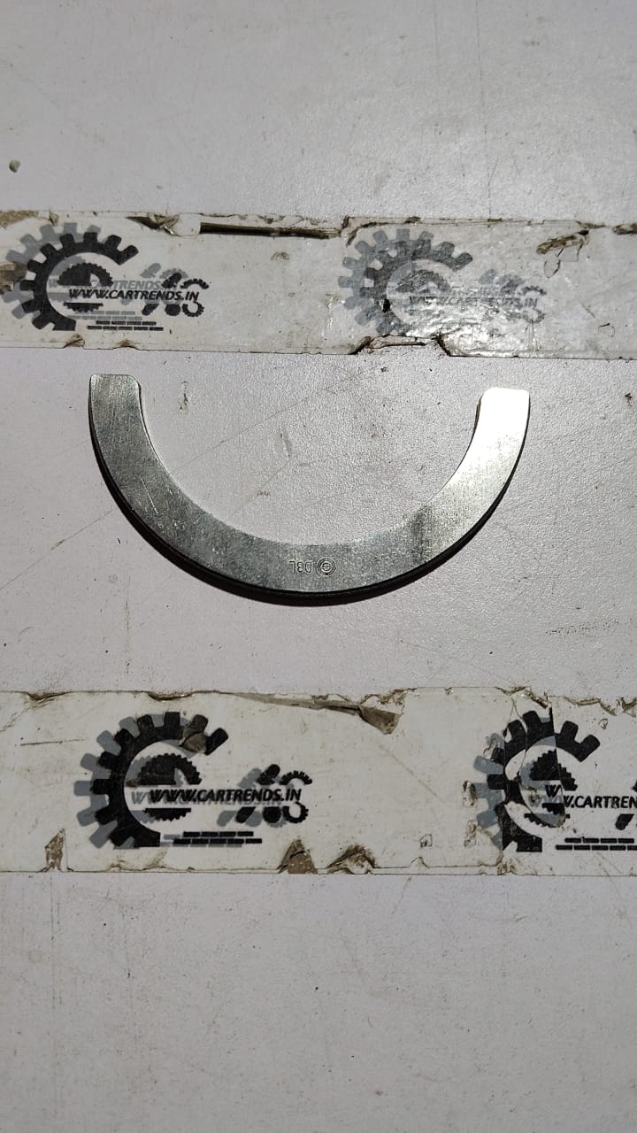 Maruti Suzuki crank thrust bearing for Alto K10 engine, showing the metallic bearing component with detailed markings.