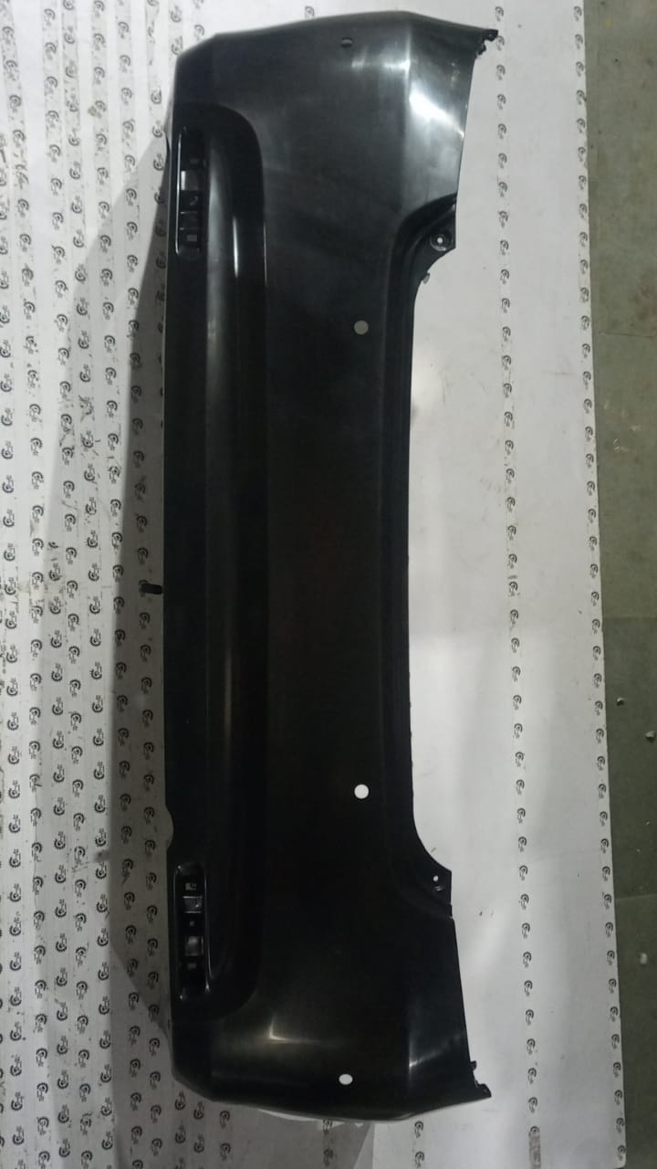 Maruti Suzuki rear bumper part 71811M54T005PK, compatible with Maruti Suzuki vehicles, shown in close-up image.