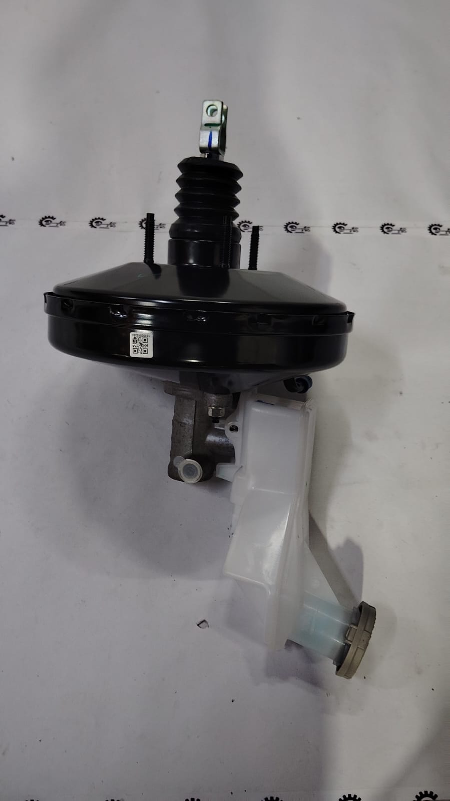 Maruti Suzuki brake master cylinder assembly for Wagon R vehicle, showing the cylinder part with mounting and connection points.