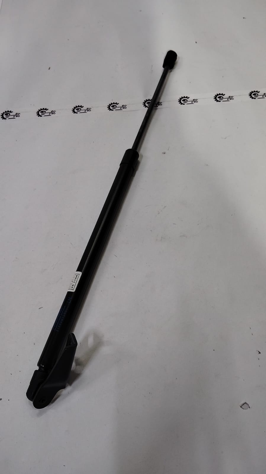 Maruti Suzuki Dicky Shocker LH for Ertiga, automotive suspension part, shown in the image with branded packaging.