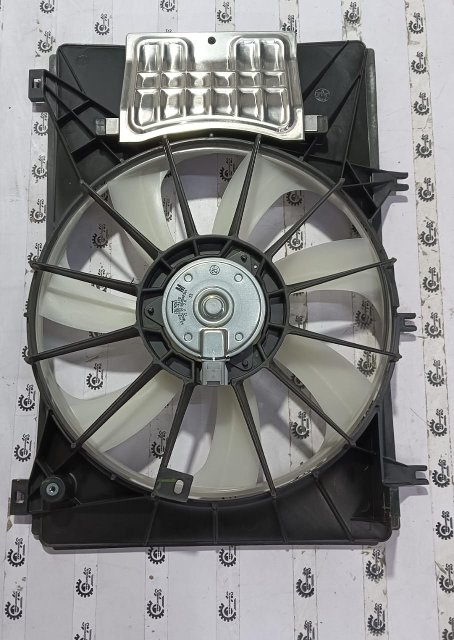 Maruti Suzuki Baleno fan assembly with model number 17100M68P00, shown in a close-up view of the vehicle's cooling system.