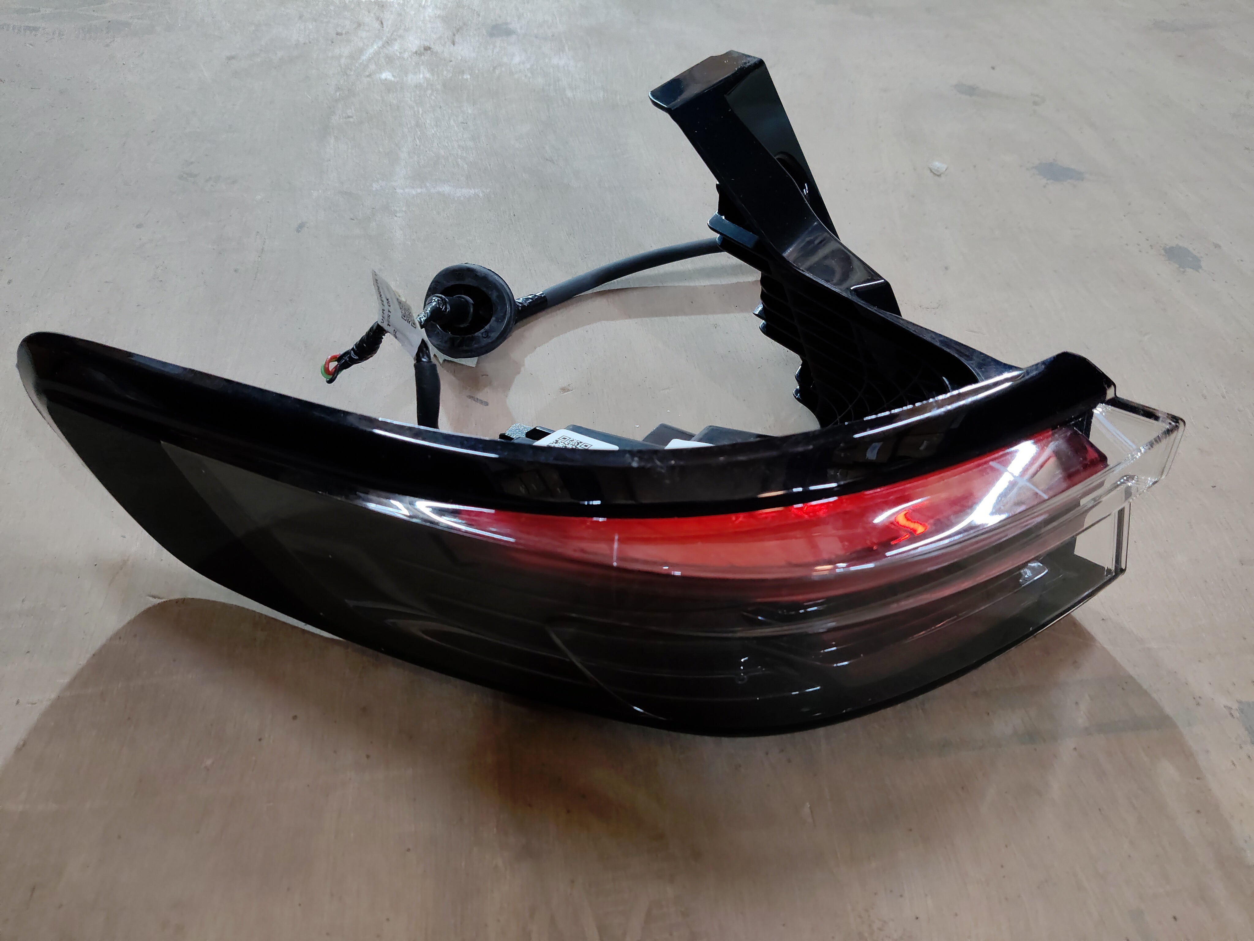 Maruti Suzuki tail and stop lamp assembly showing the rear vehicle lighting component for Maruti Suzuki cars.