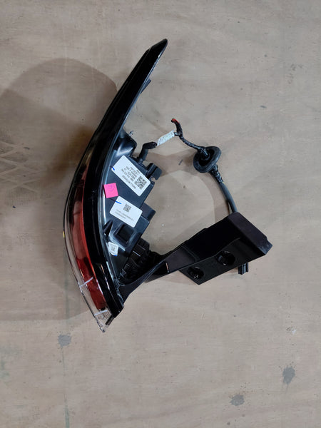 Maruti Suzuki tail and stop lamp assembly for vehicle, showing the complete lens and housing in a close-up shot.