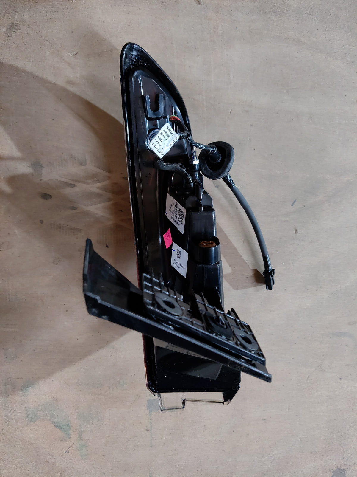 Maruti Suzuki tail and stop lamp assembly, part number 35802M76T01, showing the vehicle's rear lighting component.