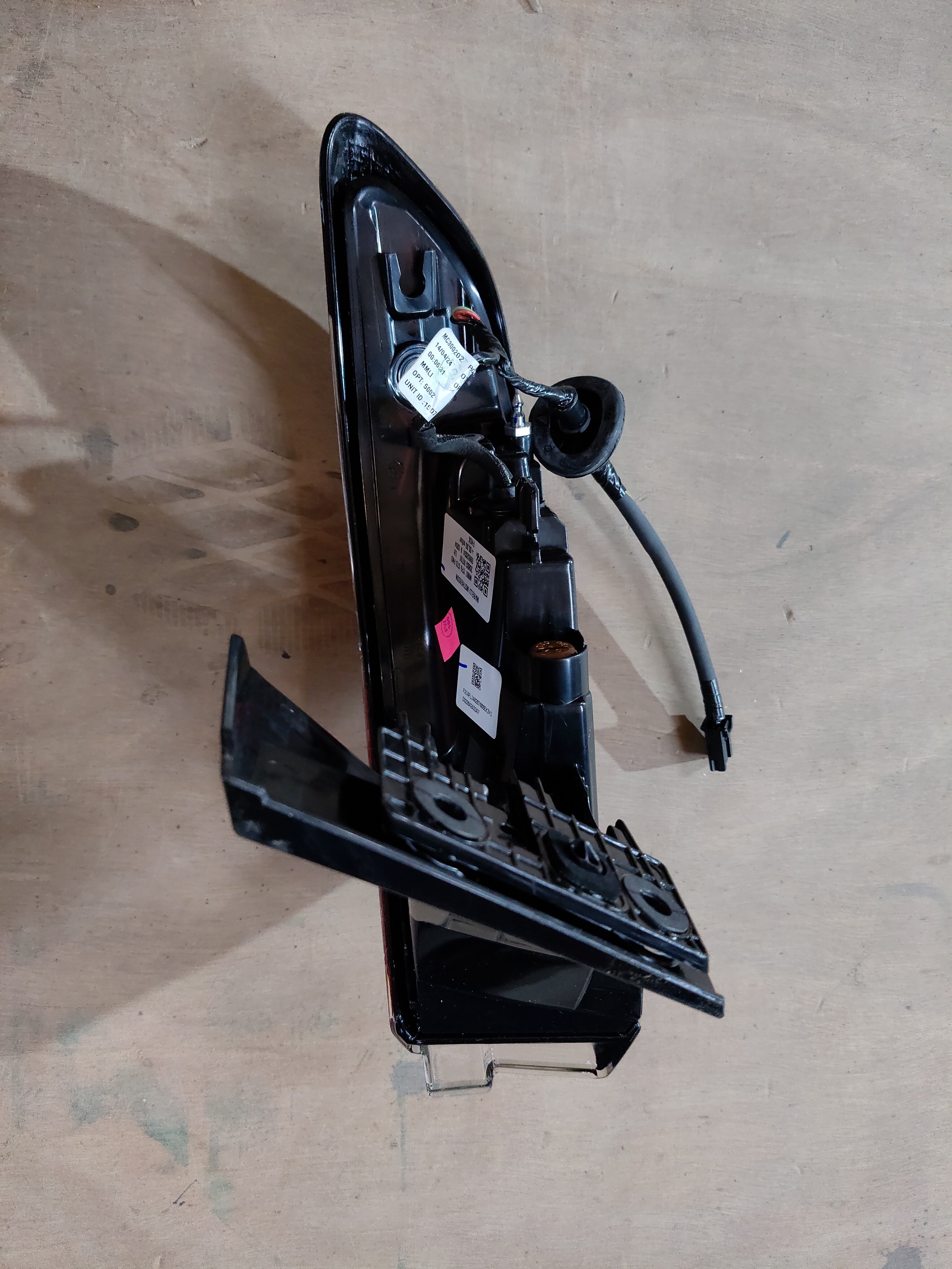Maruti Suzuki tail and stop lamp assembly, part number 35802M76T01, showing the vehicle's rear lighting component.