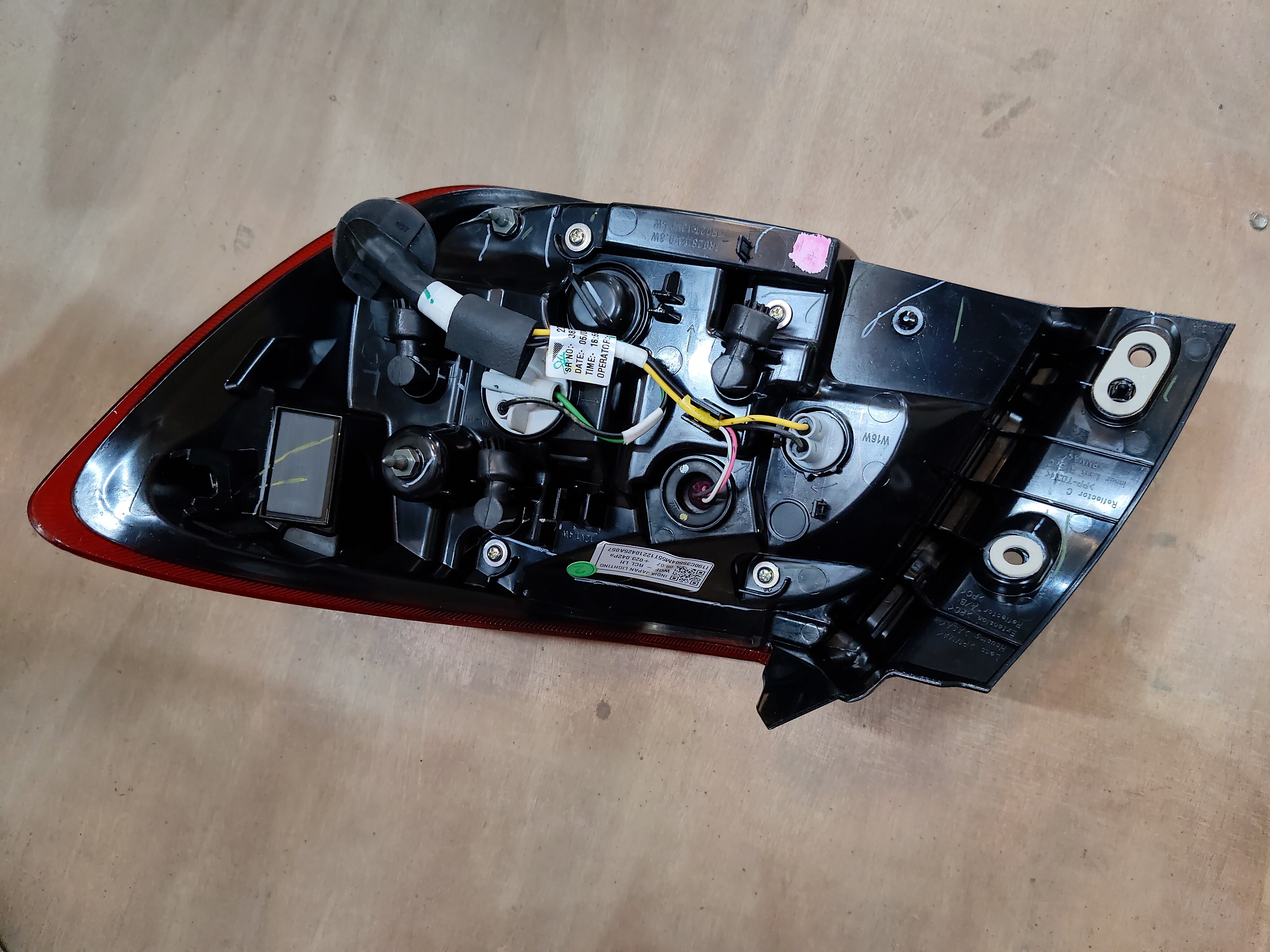 Maruti Suzuki lamp unit RR combinational headlamp assembly for vehicle, with clear lens and mounting brackets.