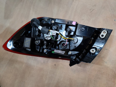 Maruti Suzuki lamp unit RR combinational headlamp assembly for vehicle, with clear lens and mounting brackets.
