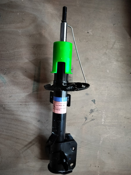 Front left strut assembly for Maruti Suzuki vehicle, part number 41602M79M01, showing the suspension component in detail.