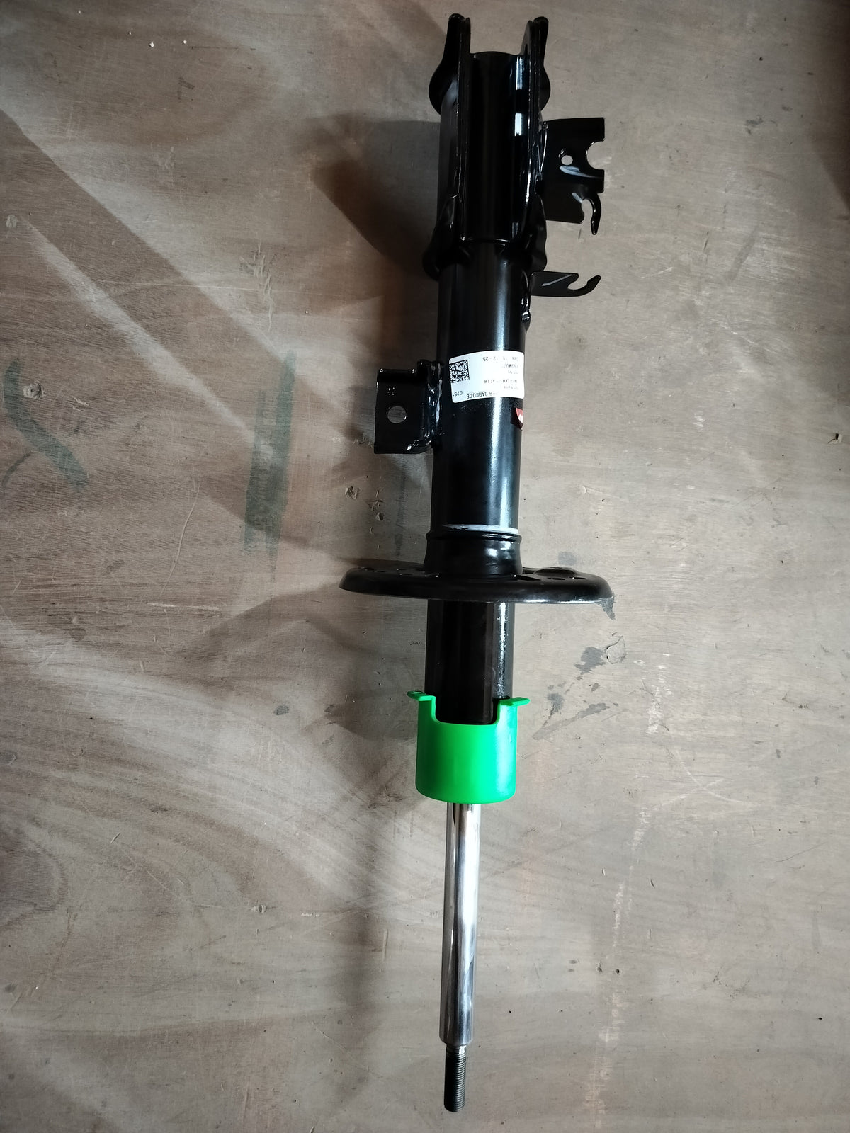 Maruti Suzuki front strut assembly with spring for suspension system, part number 41602M85S00.