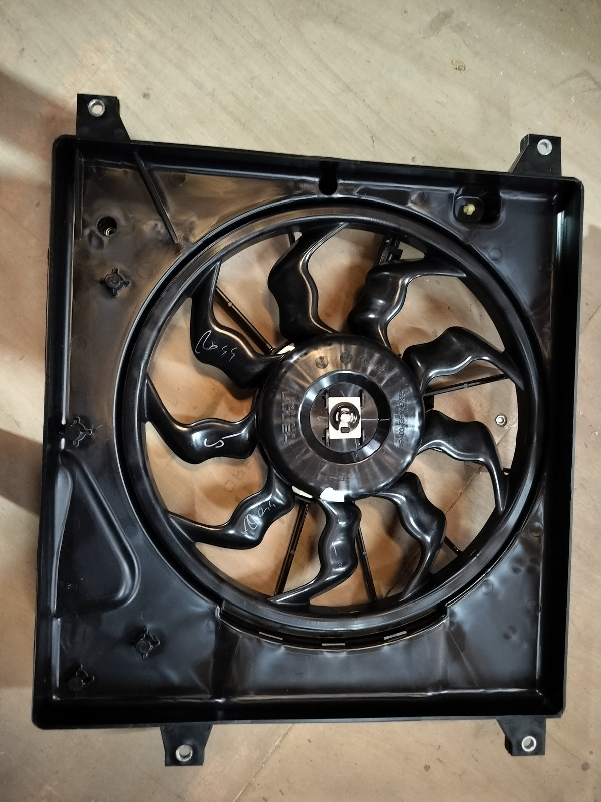 Maruti Suzuki radiator fan assembly for S-Presso, showing the black plastic fan and mounting components.