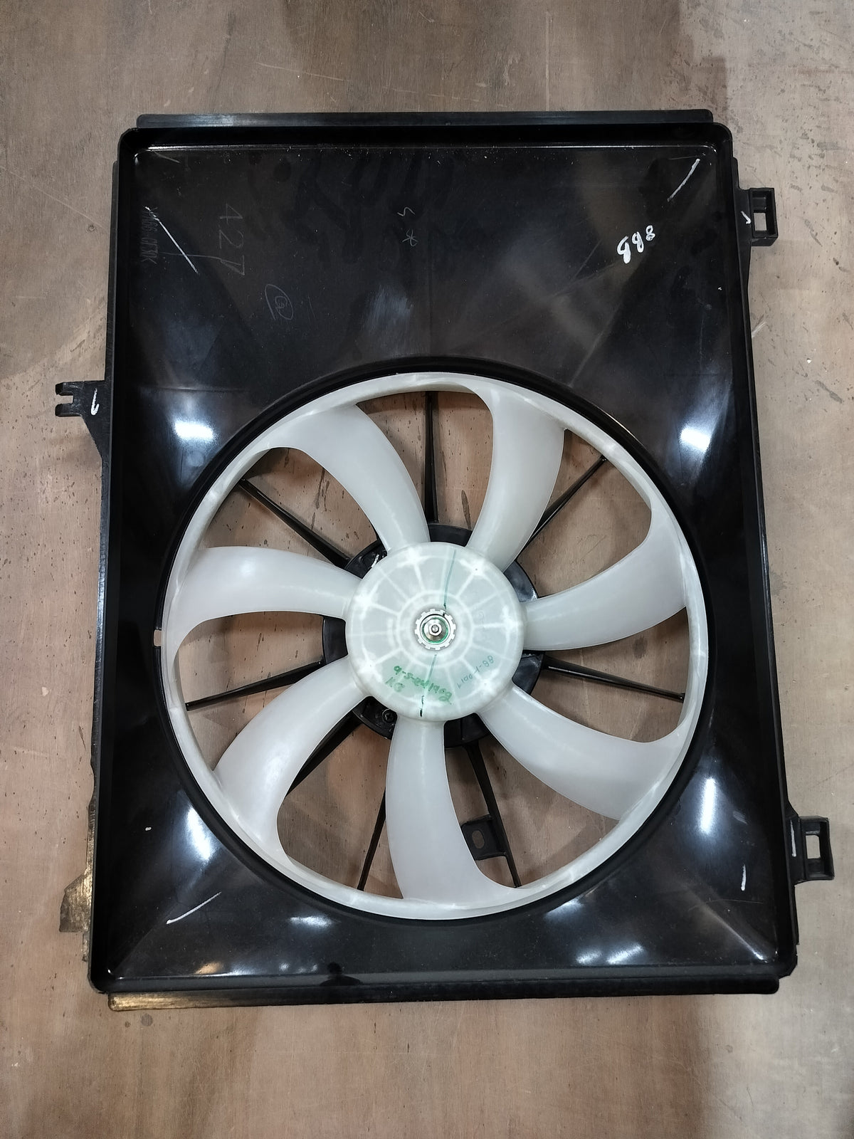 Maruti Suzuki Swift fan assembly part number 17100M74L00, showing the engine cooling fan and related components.