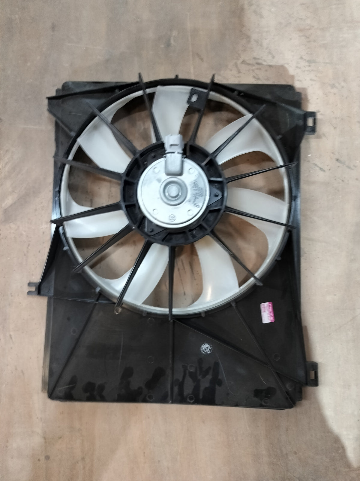 Maruti Suzuki fan assembly for Swift Type 2, showing the black plastic fan blade and mounting components.