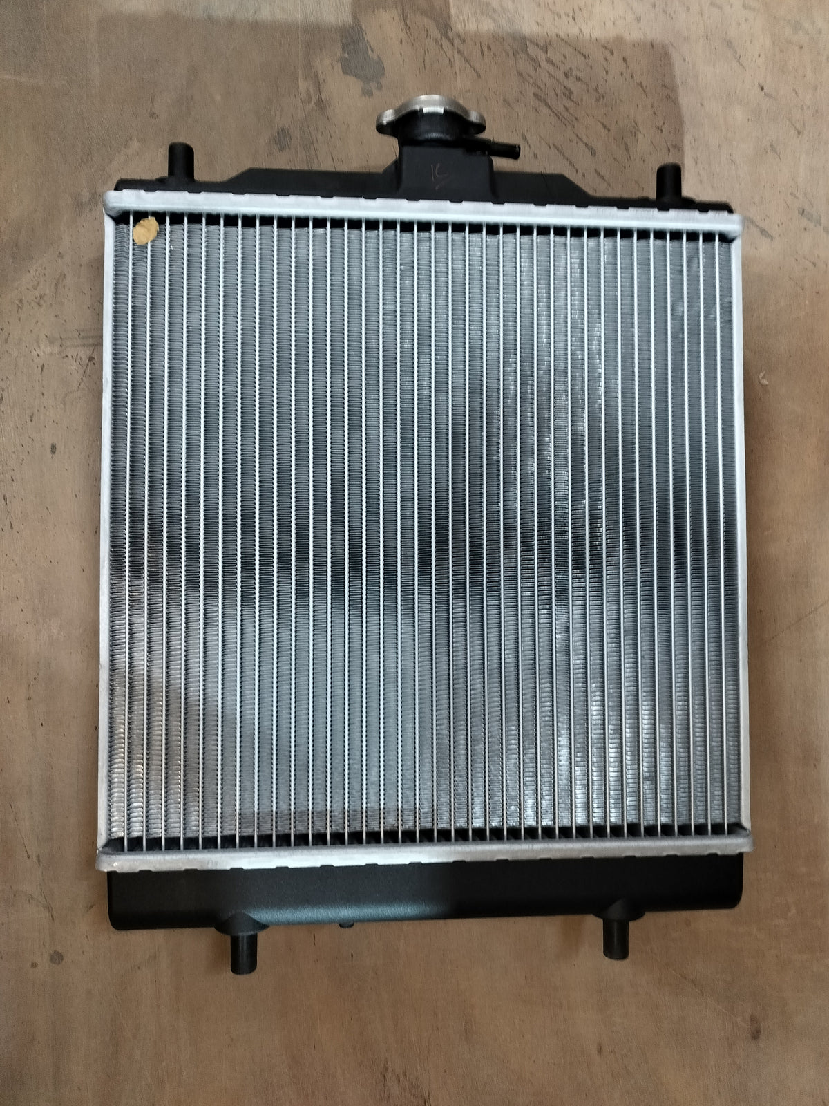Maruti Suzuki radiator for Eeco vehicle, showcasing the core and fins of the car cooling system.