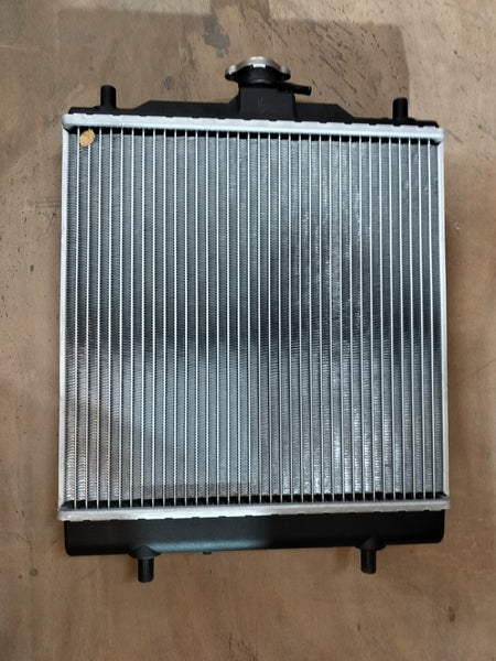 Maruti Suzuki radiator for Eeco vehicle, showcasing the core and fins of the car cooling system.