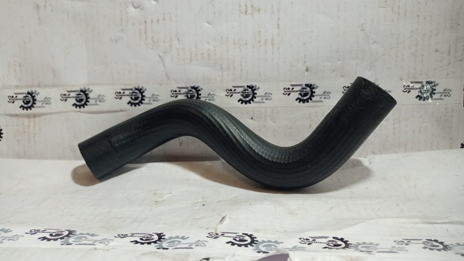 Maruti Suzuki radiator inlet hose for Stingray model, flexible rubber tubing with metal clamps visible in the image.