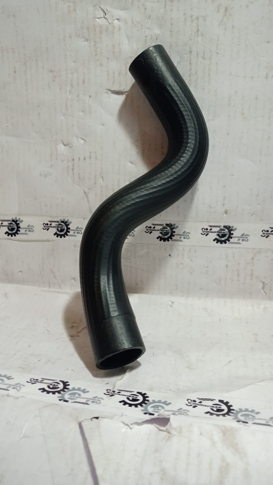 Maruti Suzuki radiator inlet hose for Stingray, black rubber car part with hose connections, engine cooling component.