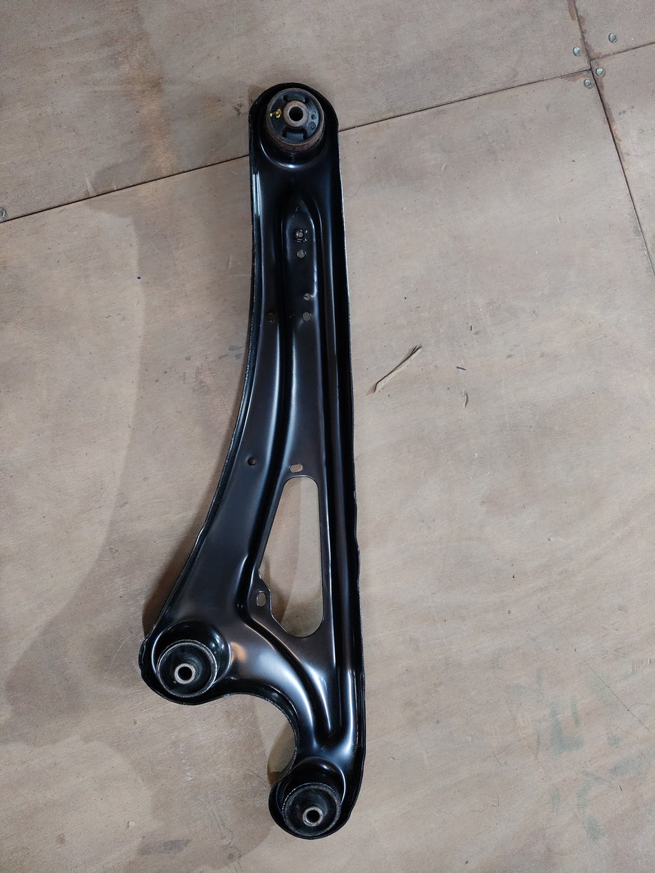 Maruti Suzuki rear trailing arm assembly part 46201M67L00, vehicle suspension component, shown in the image.