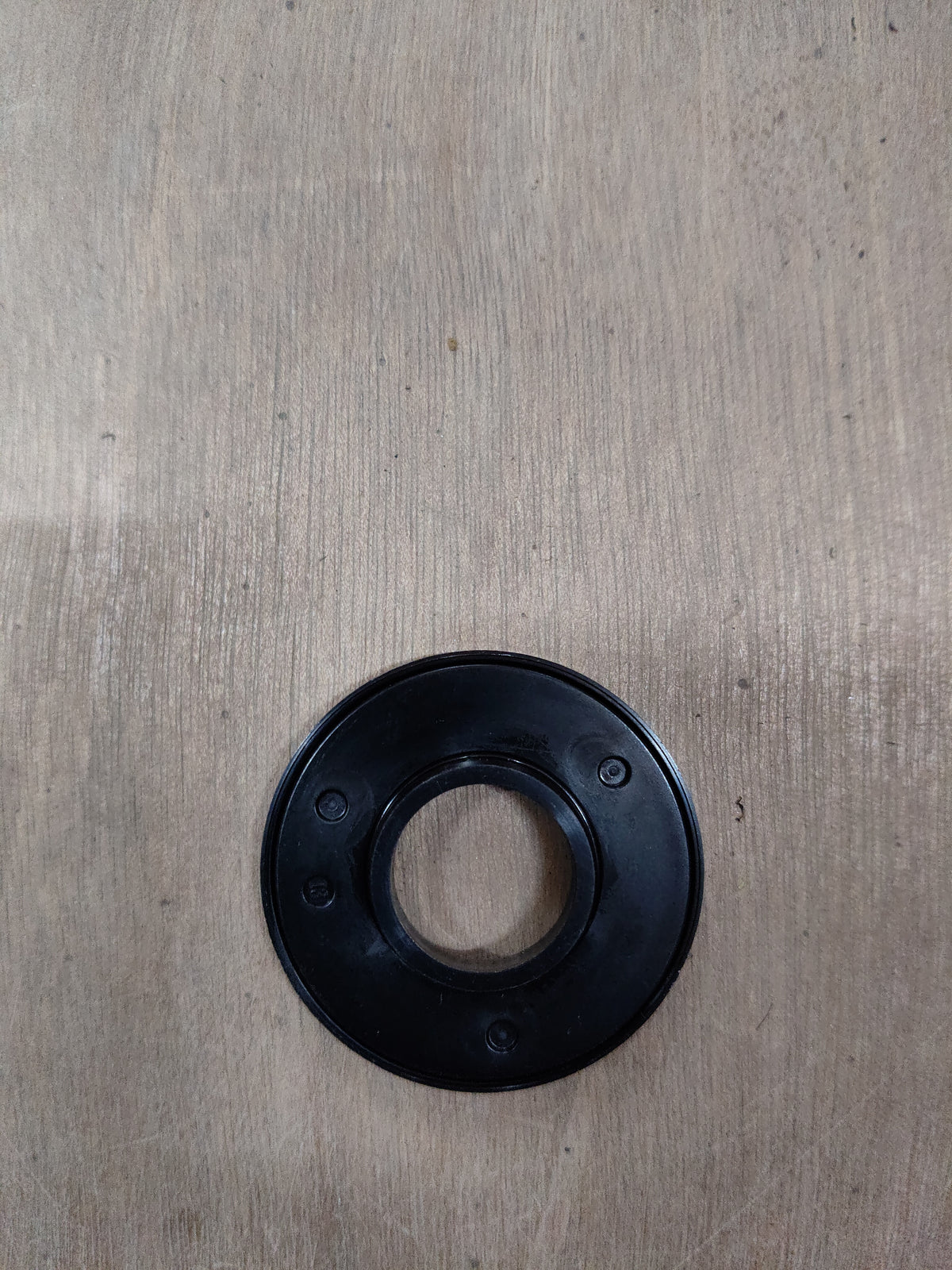 Maruti Suzuki front strut bearing, part number 41741M67L00, showing the metal component with mounting details.