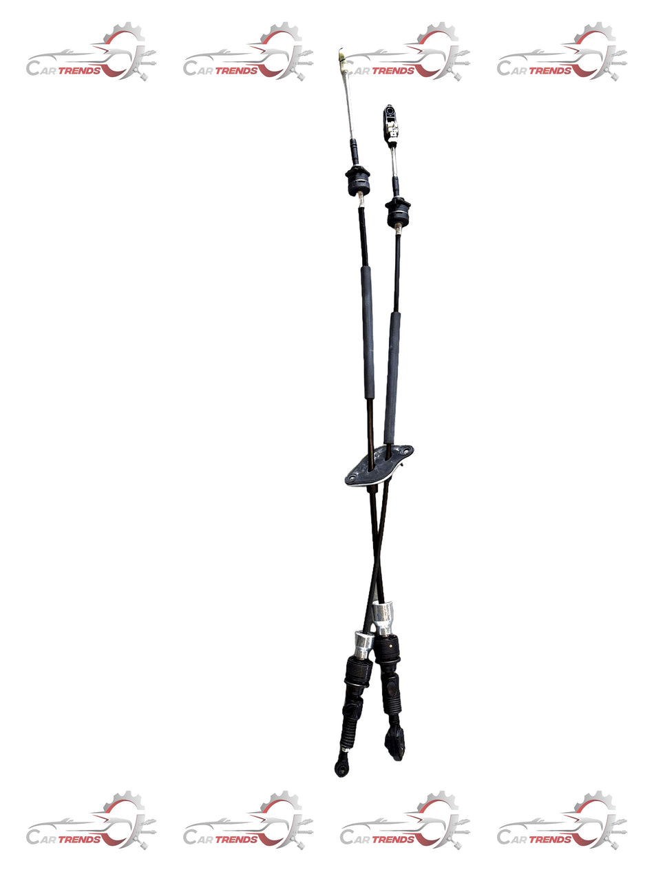 Maruti Suzuki shift and select control cable assembly, car part with black and metallic components, for vehicle transmission system.