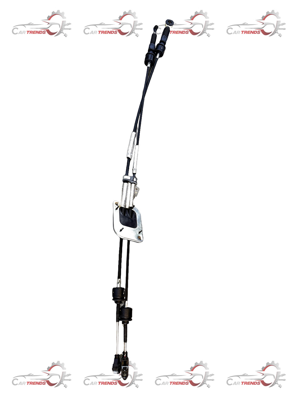 Maruti Suzuki shift and select cable assembly, black plastic and metal components, for vehicle gear shifting system.