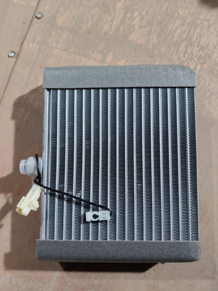 Maruti Suzuki cooling coil for Wagon R K-series engine, showing the metal coil component with electrical connections.