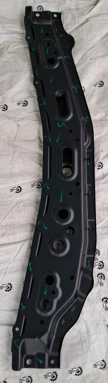 Maruti Suzuki crossmember lower front suspension part, model 71110M76M00, with mounting points and metal construction visible.