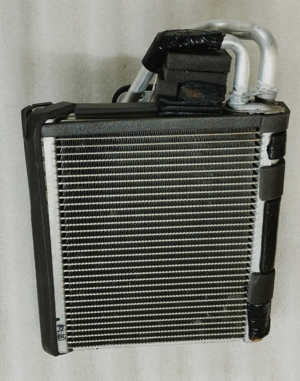 Maruti Suzuki evaporator assembly part 95411M66RC0, shown in a detailed view, for vehicle air conditioning systems.