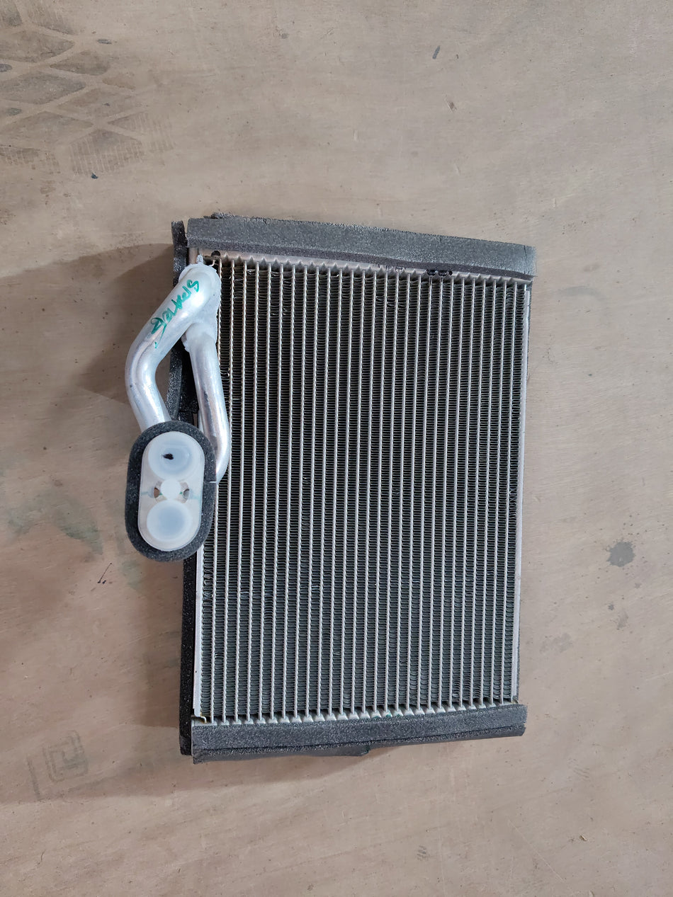 Maruti Suzuki evaporator sub-assembly part number 95411M56R00, automotive cooling component in an engine system.