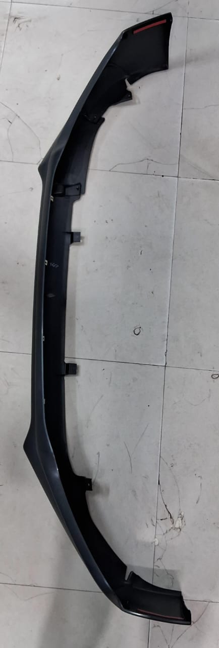 Maruti Suzuki front bumper extension component with part number 71780M58R005PK, showing the vehicle's bumper detail.