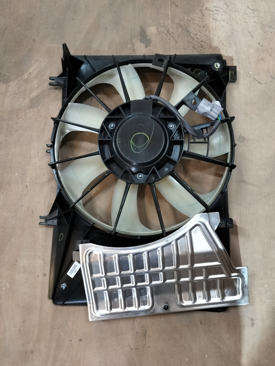 Maruti Suzuki engine cooling fan assembly for model 17100M74T00, showing the fan and mounting components.