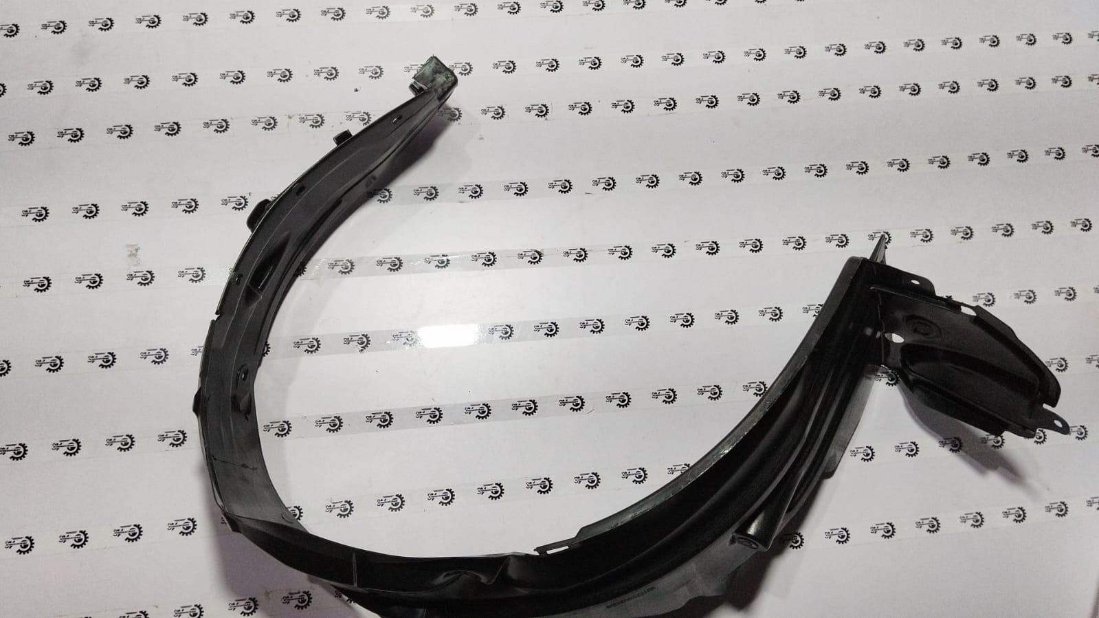 Maruti Suzuki Celerio LH side fender lining, part number 72322M76M01, showing the black plastic inner wheel arch component