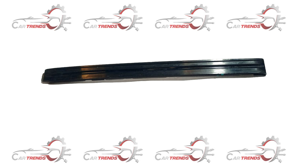 Maruti Suzuki timing chain guide 12771M77M00 showing close-up of black plastic component with metal clips.