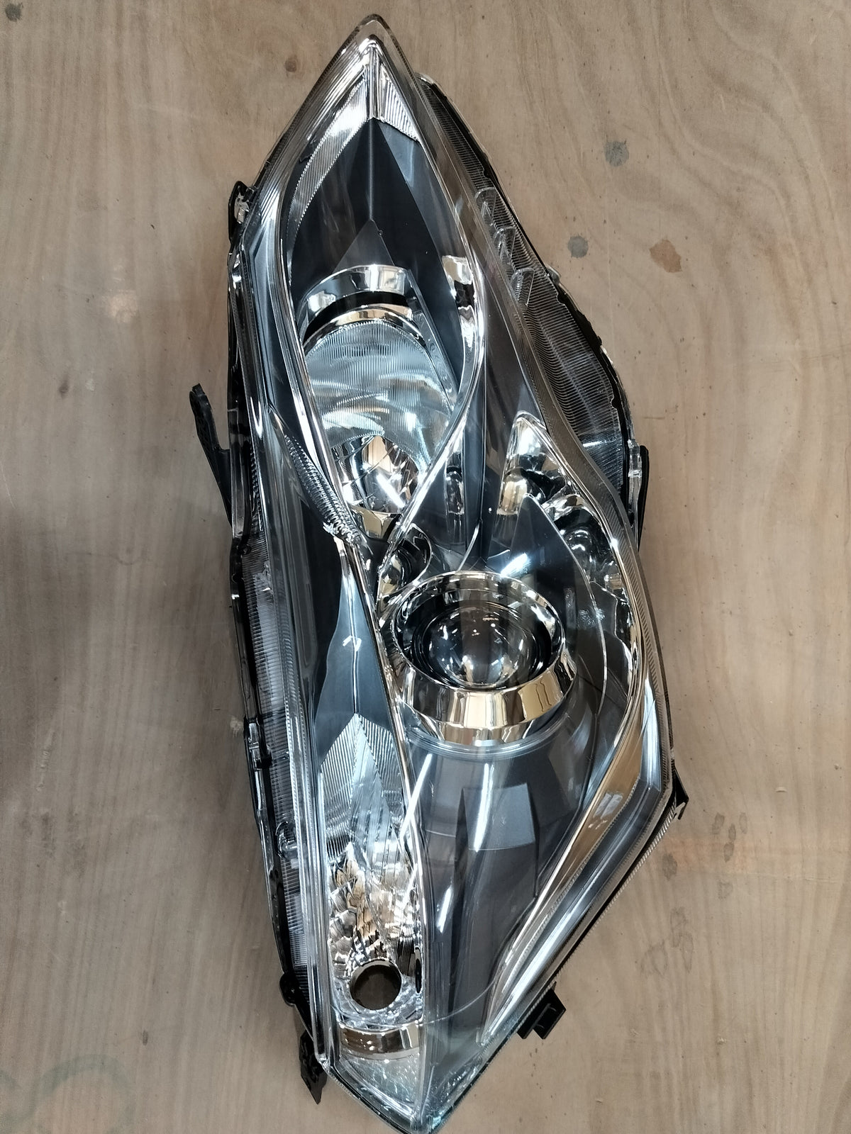 Maruti Suzuki Ciaz right headlamp with LED, model 35121M79M02, showing the clear lens and lighting components.