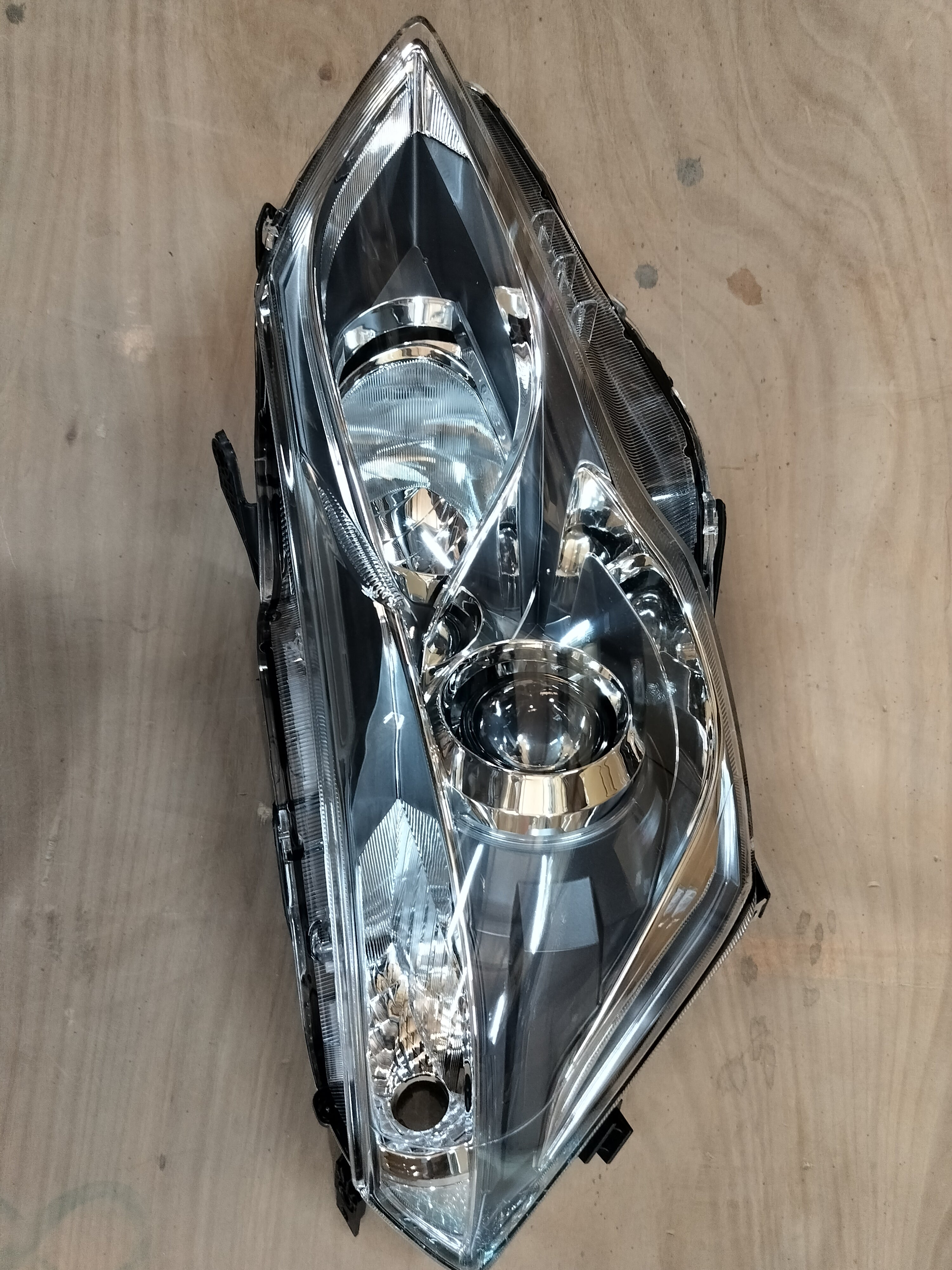 Maruti Suzuki Ciaz right headlamp with LED, model 35121M79M02, showing the clear lens and lighting components.