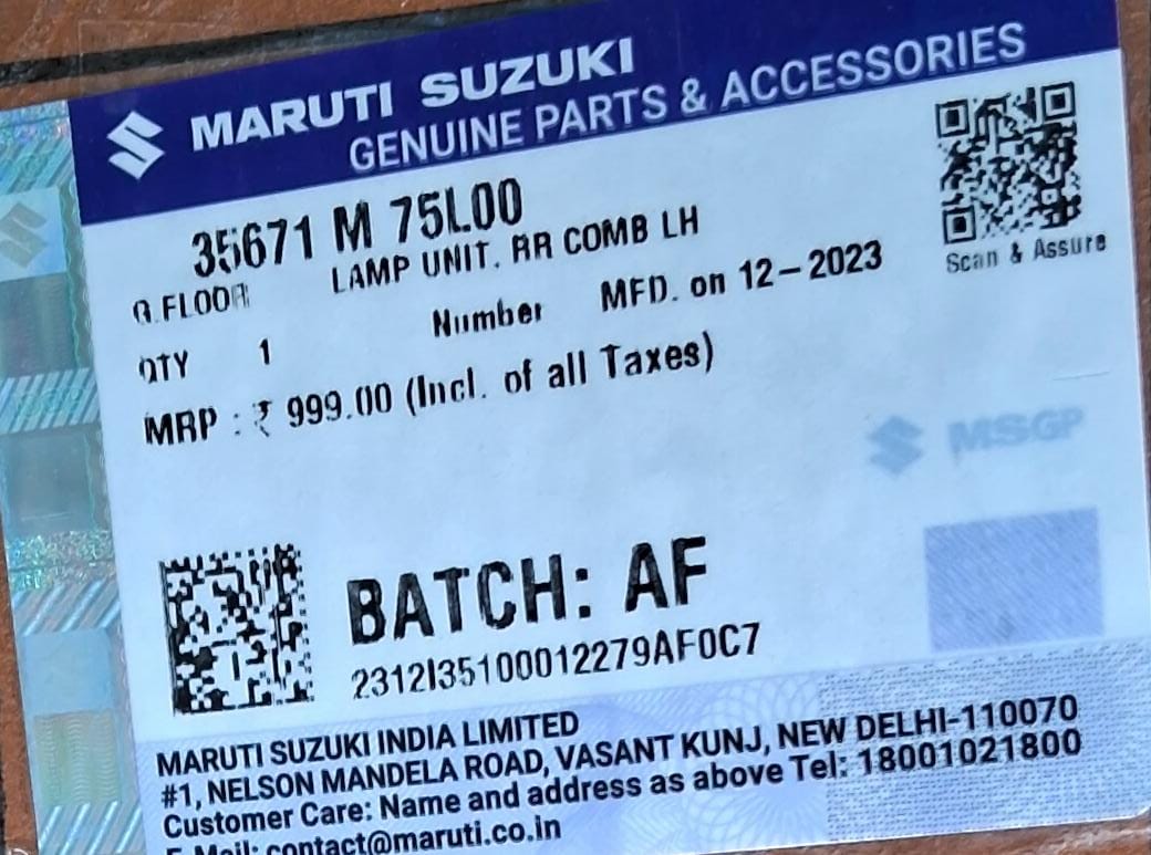 Maruti Suzuki lamp unit RR comb LH 35671M75L00, automotive headlamp component for Maruti Suzuki vehicles, close-up view.