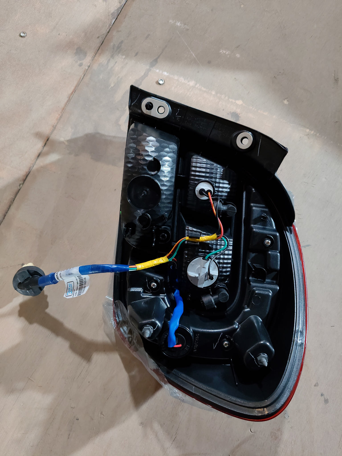 Maruti Suzuki rear combination lamp unit for Alto K10, left-hand side, installed on the vehicle.