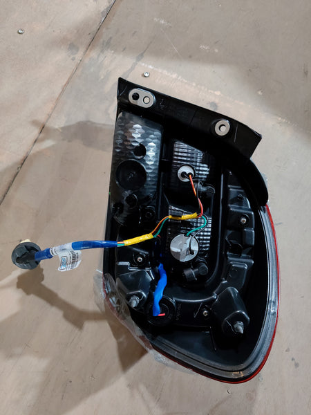 Maruti Suzuki rear combination lamp unit for Alto K10, left-hand side, installed on the vehicle.