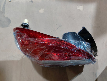 Rear combination lamp unit for Maruti Suzuki Alto K10, left-hand side, OEM part #35750M68P01.