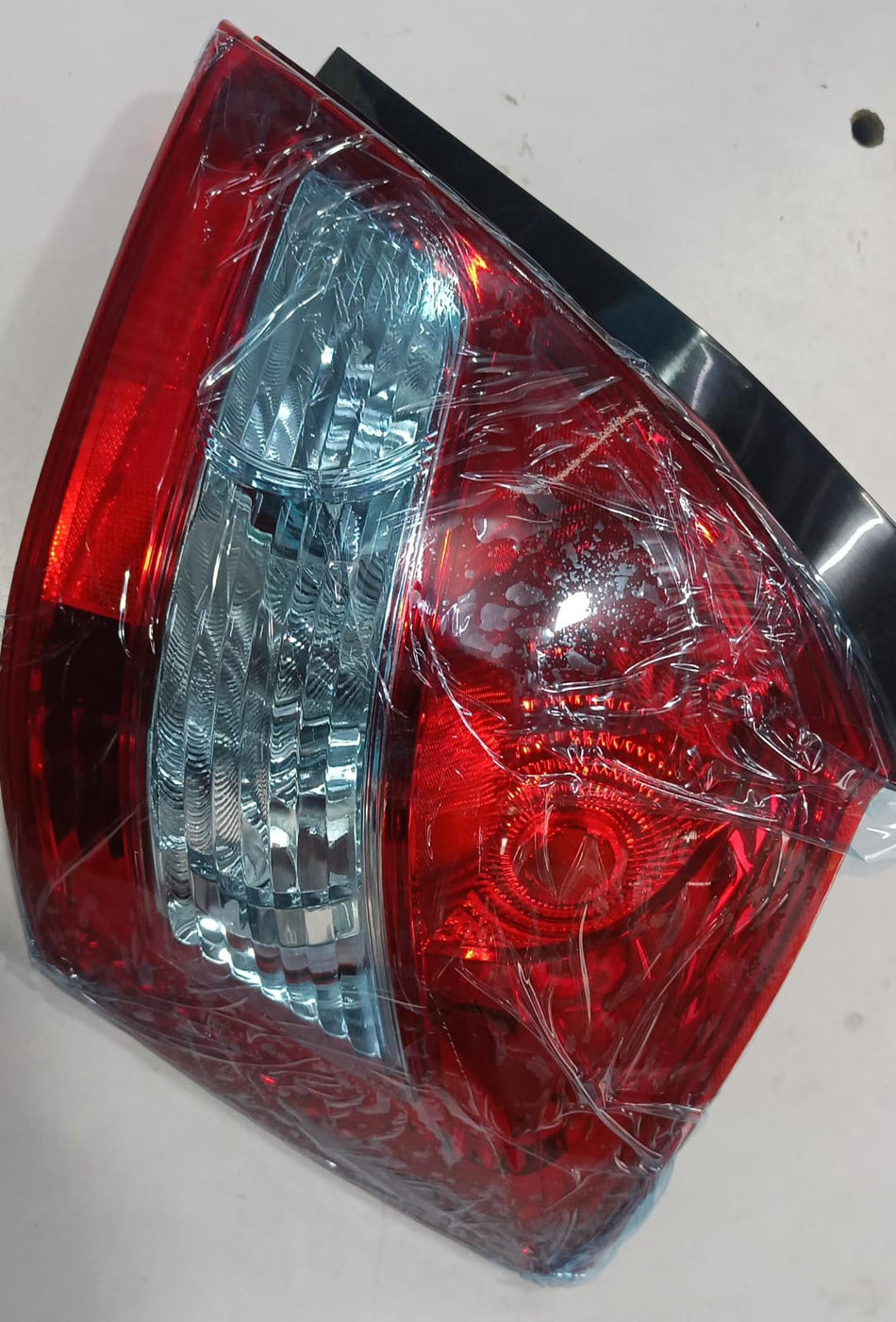 Maruti Suzuki lamp unit RR comb RH 35651M75L00 for vehicle lighting and signaling, shown in a close-up image.