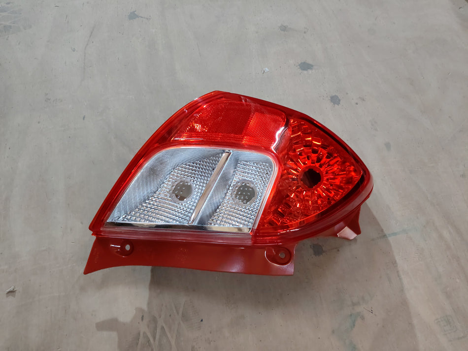 Maruti Suzuki lamp unit for vehicle, showing the compact electrical component with wiring and connectors.