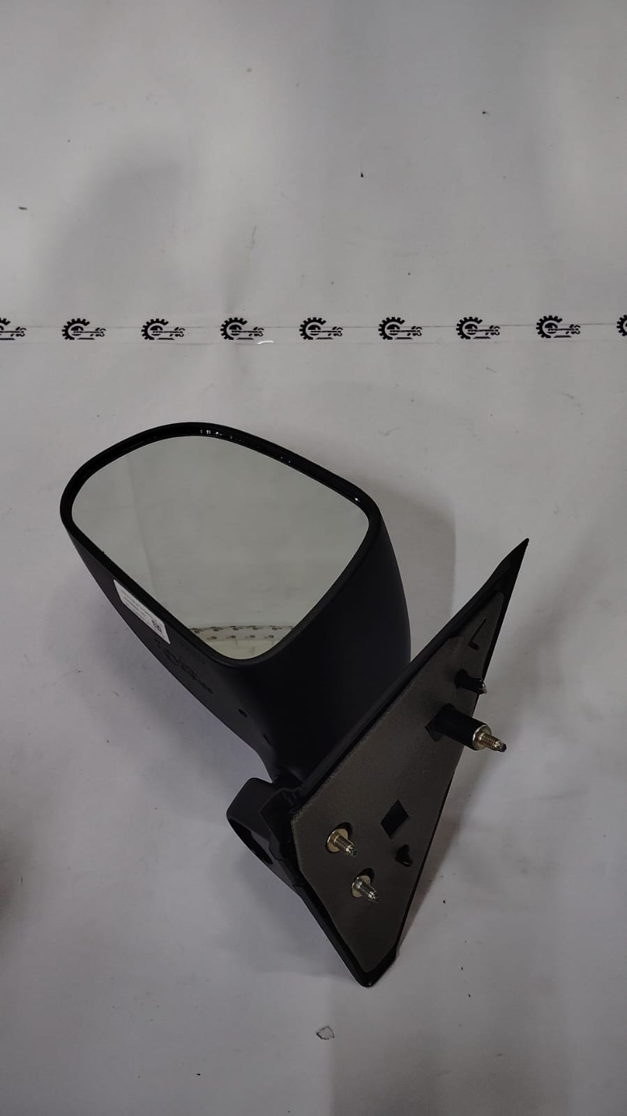 Maruti Suzuki Waganor left outside rear view mirror assembly, black plastic housing with mirror glass for vehicle side view.