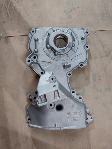 Maruti Suzuki oil pump assembly for Wagon R Type 2, showing the detailed metal component with mounting points and pump mechanism.