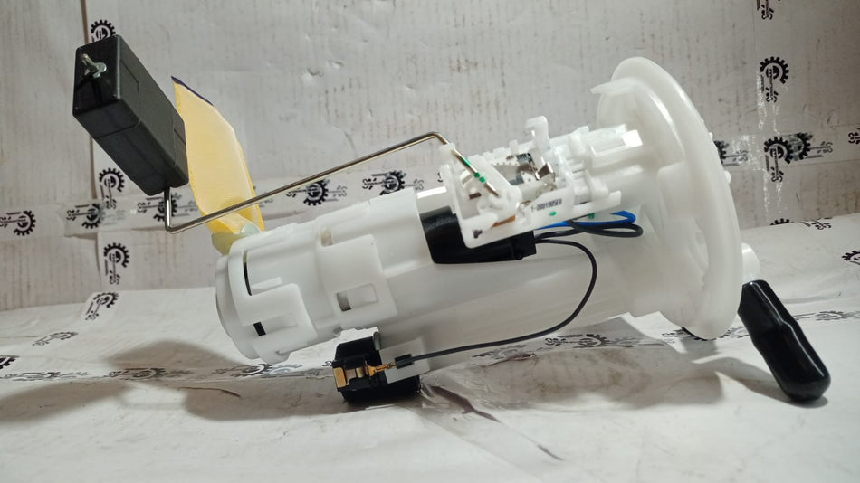 Maruti Suzuki fuel pump assembly 15100M67L13 showing the electrical connectors and pump components.