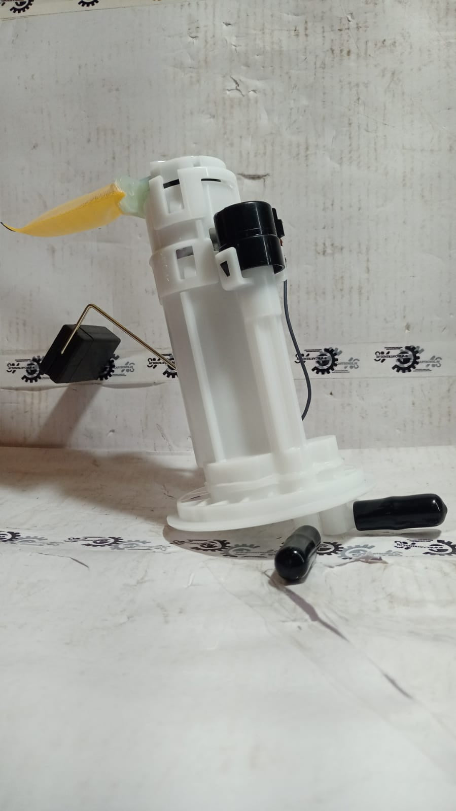 Maruti Suzuki fuel pump assembly 15100M67L13 showing the fuel pump unit for vehicle engine fuel system.