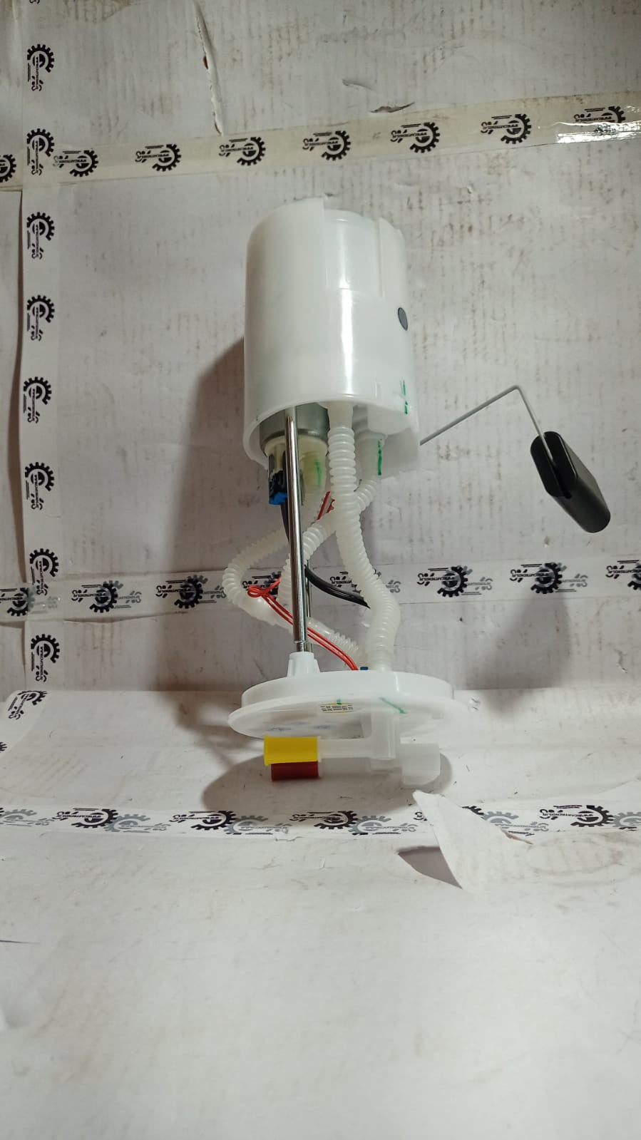 Maruti Suzuki fuel pump assembly 15100M77P00 for engine fuel system, shown in a detailed automotive image.