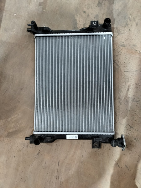 Maruti Suzuki radiator assembly 17700M77PB0 showing the engine cooling radiator for vehicle cooling system