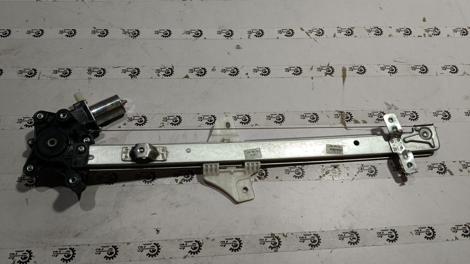 Maruti Suzuki front right window regulator assembly part number 83401M76M20 showing the mechanical components.
