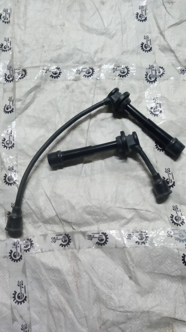 Maruti Suzuki ignition cable for Baleno, showing the cable with connectors and packaging, designed for vehicle ignition system.