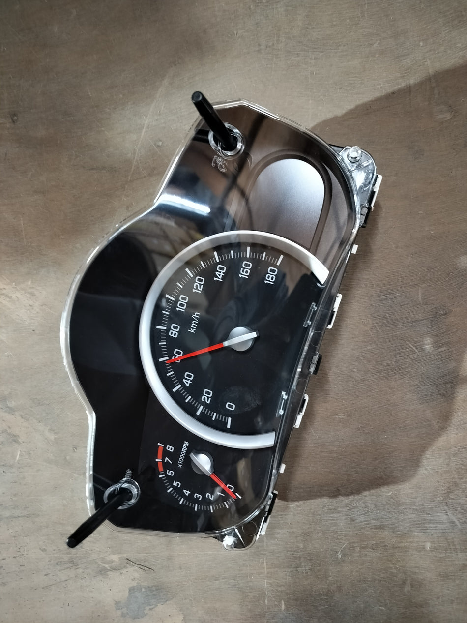 Maruti Suzuki speedometer assembly for Celerio model, showing the dashboard and instrument cluster with speed display.
